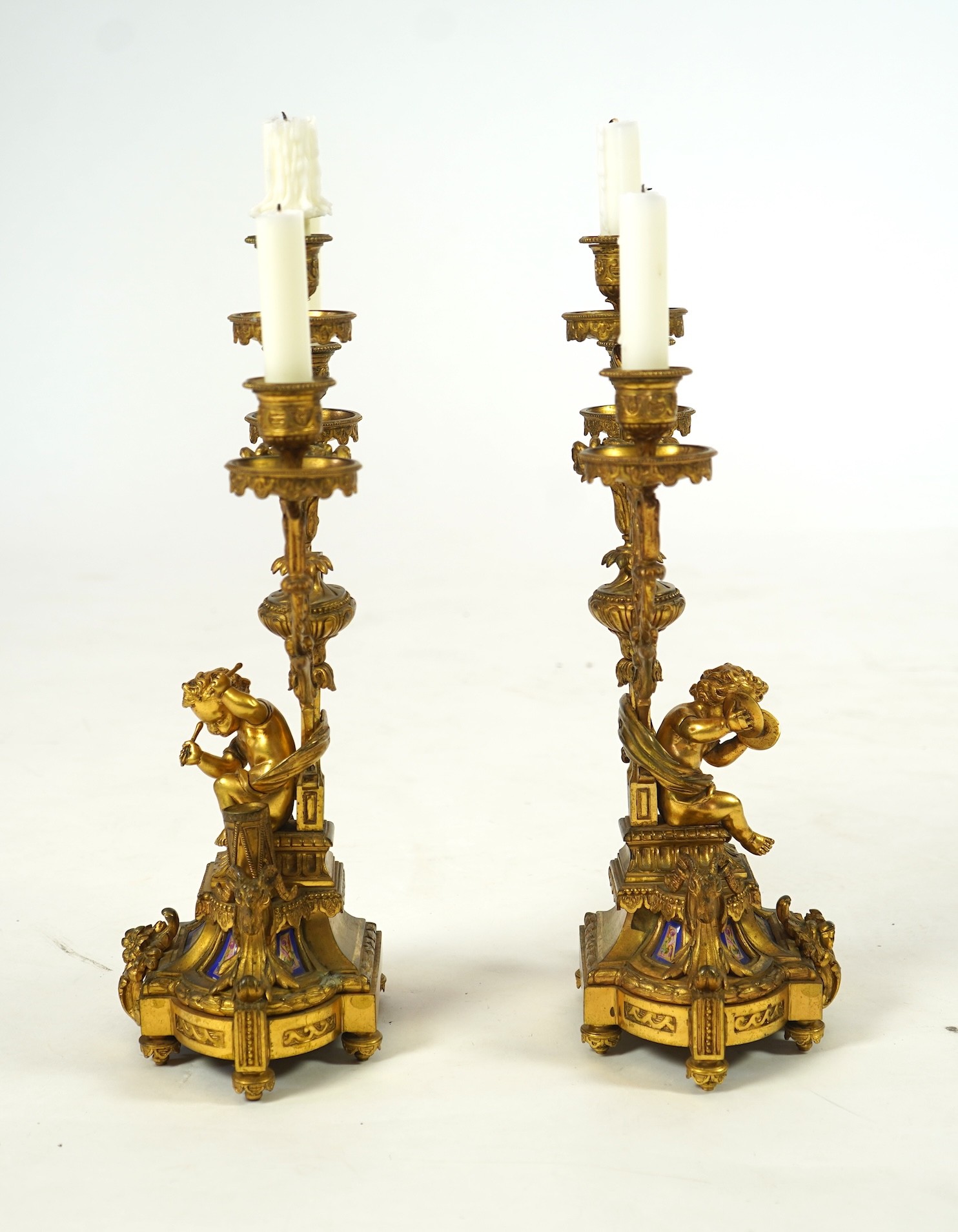 A pair of 19th century French Louis XVI style ormolu three light candelabra